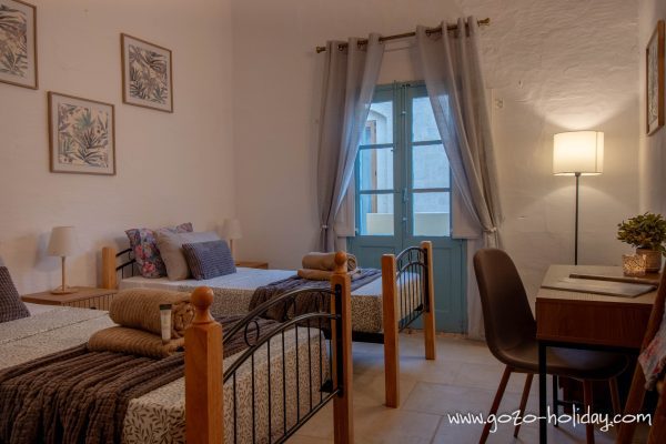 Two singles beds in third bedroom